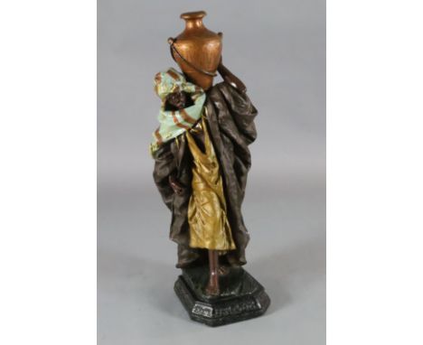 A Goldscheider style painted plaster figure of an Arab water carrier, H.40in.
