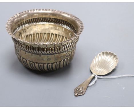 A late Victorian silver sugar bowl and a modern silver caddy spoon.