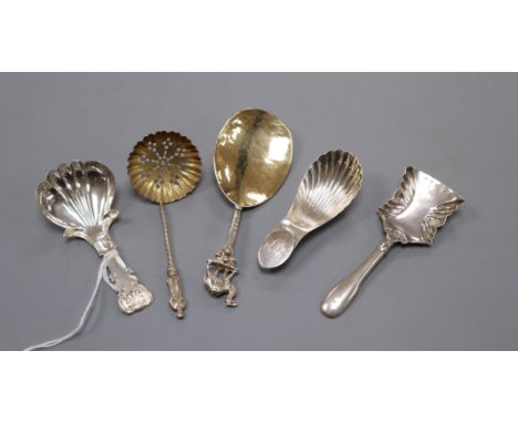 A George IV silver caddy spoons, John Bettridge, Birmingham, 1821, three other silver caddy spoons and a silver sifter spoon.
