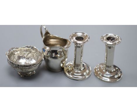 A George III silver helmet cream jug, a 1920's imported German silver bowl and a pair of silver dwarf candlesticks(a.f.).