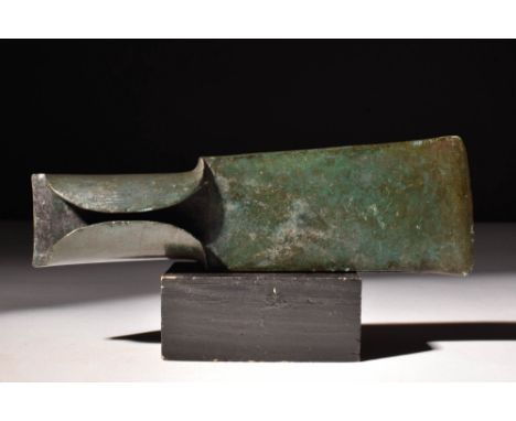 Ca. 2nd millennium BC. A bronze axe head with a socket cast in one piece with a flat axe blade with a slightly curved cutting
