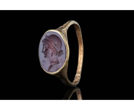 Ca. AD 50 - 100.An oval-shaped intaglio with a portrait of Antonia. The engraved gem depicts a left-facing profile. The hair 