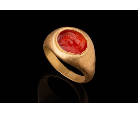Ca. AD 200 - 300 .An oval-shaped carnelian intaglio featuring a portrait of a laurel-wreathed head of an emperor, facing left