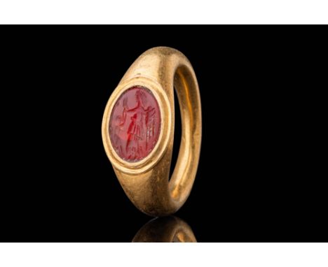 Ca. AD 50 - 200 .An oval-shaped carnelian intaglio engraved with the figure of winged Victory, depicted in her left profile. 