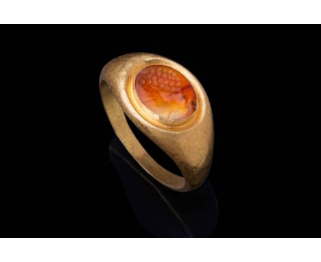 Ca. AD 50 - 100.A carnelian intaglio with a portrait of Emperor Nero. The intaglio depicts a profile facing left. The head sh