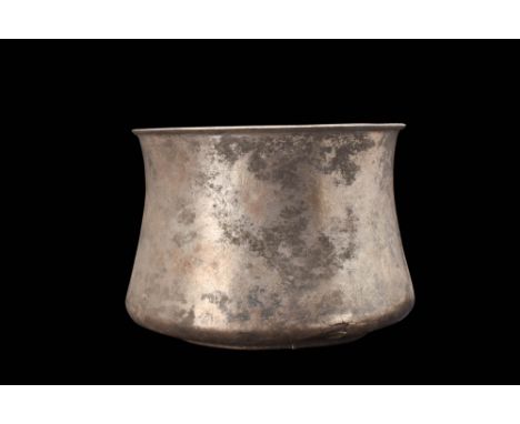 Ca. AD 100 - 300A stunning silver vessel with a deep basin, a flat base, smooth corseted walls, and a wide opening with an ev