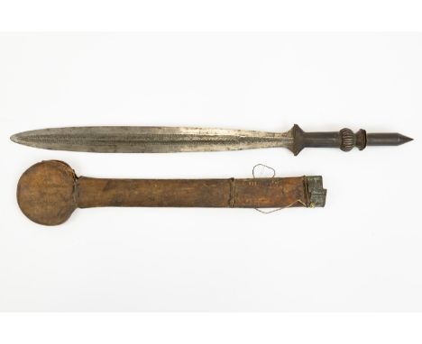 An African sword of the Yaka tribe, leaf shaped blade 20" with punched decoration for its entire length, the hilt with plain 