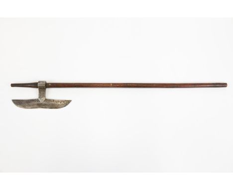 An Indian axe from Chota Nagpur, blade 8½" with some simple decoration, on its plain wood haft, 31" overall. GC £40-50 