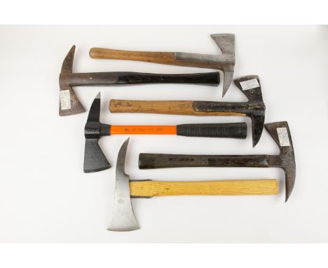 A fireman's axe, complete with belt and pouch; another axe with pouch; also 4 other axes. GC (6) £70-75 
