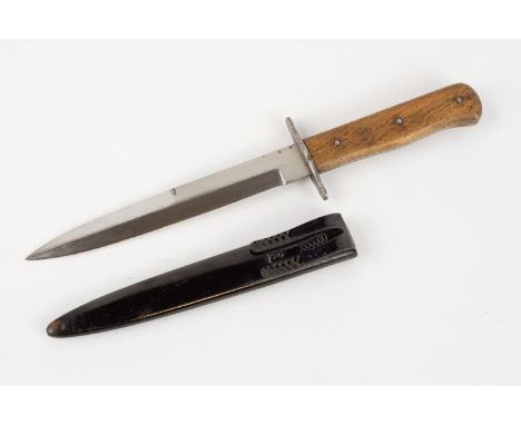 A good WWII German Luftwaffe "boot knife", blade 6½" with  Luftwaffe waffenamt mark, plain wood grips and steel cross piece, 
