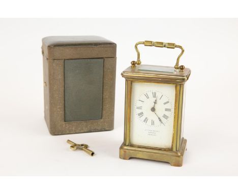 A brass cased carriage clock, by Arthur Baker, Carfax, Horsham, with carrying handle, GC and appears to be in GWO, with its l