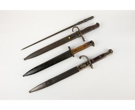 A French Mas 1936 bayonet; a continental saw backed Mauser type bayonet with steel and leather scabbard; 2 other Mauser type 