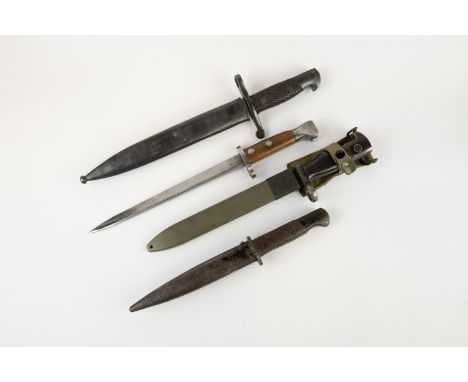 A Spanish M1941 Bolo bayonet; an M1969 Cetme bayonet; a Mauser bayonet; also a Dutch Mannlicher bayonet (no scabbard). GC (4)