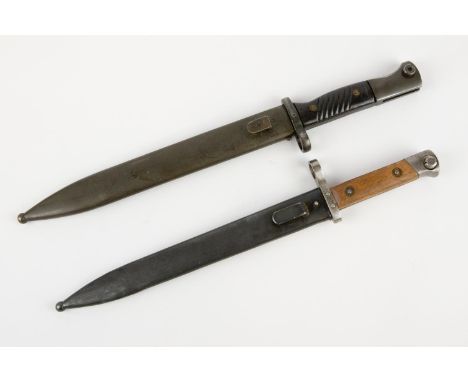 An Israeli manufactured M1949 bayonet, in its steel scabbard; and an Austrian M1895 Mannlicher bayonet, in its steel scabbard