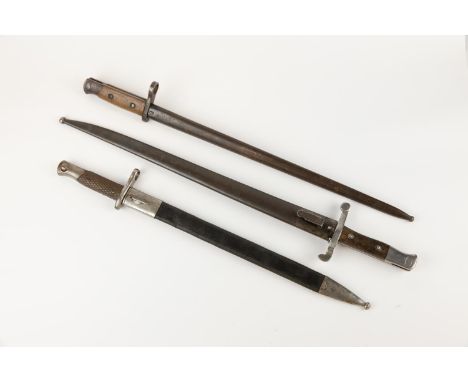 A Spanish M1893 bayonet, in steel mounted leather scabbard; a Belgian M1924 bayonet; and one other continental bayonet. GC (3