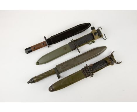 A Commercial M7 knife bayonet; a US official M7 in its M8A1 scabbard; also 2 other bayonets. VGC (4) £80-100 