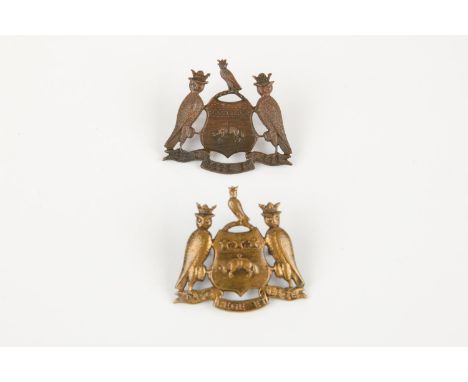 A "Kitchener's Army" cap badge of the Leeds Pals (15th &amp; 17th Bns. West Yorkshire Regt), and another, bronzed, example (d