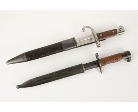 A Mexican M1897 bayonet for the Remington Rifle, the blade marked "Remington Arms Co. Ilion. N.Y." in its scabbard with sprun