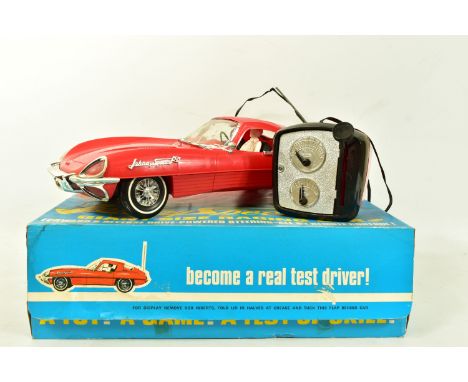 A BOXED TOPPER TOYS JOHNNY SPEED GIANT SIZE RACING CAR, catalogue no. 6600 1960's plastic battery operated Jaguar E type, loo