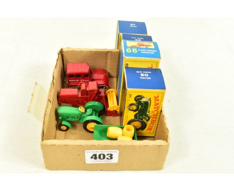 FOUR BOXED MATCHBOX HEAVY MACHINERY AND AGRICULTURAL MODEL VEHICLES, comprising of a Snow-Trac, no. 35, painted red although 