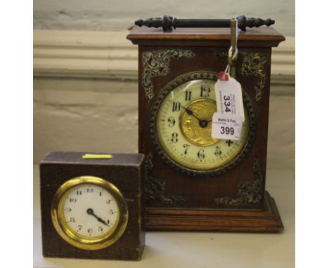 A late 19th century Continental-style mahogany framed mantle clock with brass handle and ormolu mounts, circular dial with po