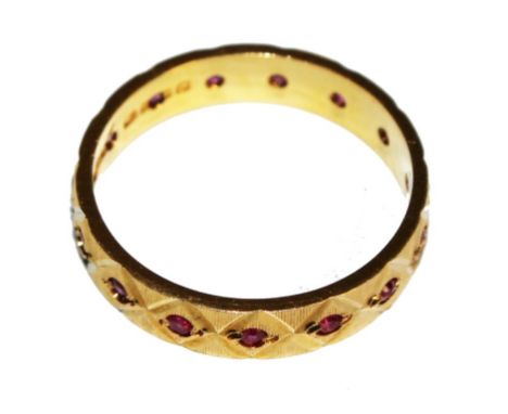 An 18 carat gold ruby set eternity ring 