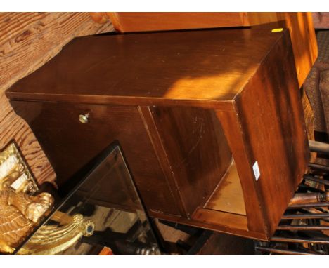 A contemporary mahogany bedside locker with shelf and one cupboard under with circular brass handle, 68cm x 38cm