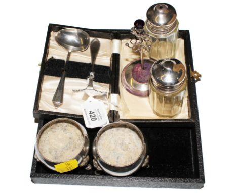 A silver ring stand with thistle finial encased child's silver spoon and a pusher, pair of silver salts, etc