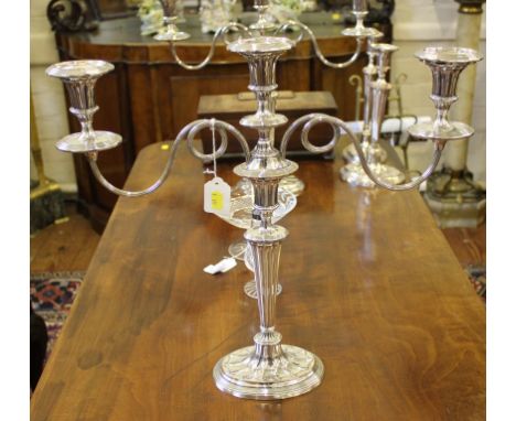 A pair of Georgian-style Adam-design two-branch table candelabra, together with a pair of matching candlestick, 45cm and 30cm