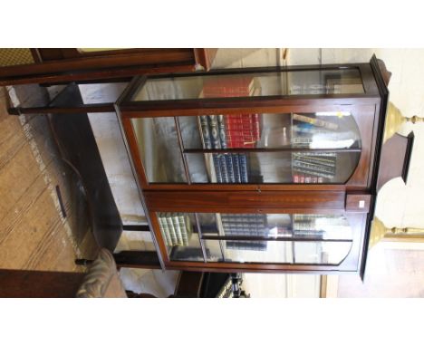 An Edwardian mahogany display cabinet with overall inlay, marquetry festoons to the gallery and centre panel, twin glazed doo