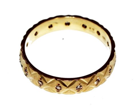 An 18 carat yellow gold diamond-set eternity ring