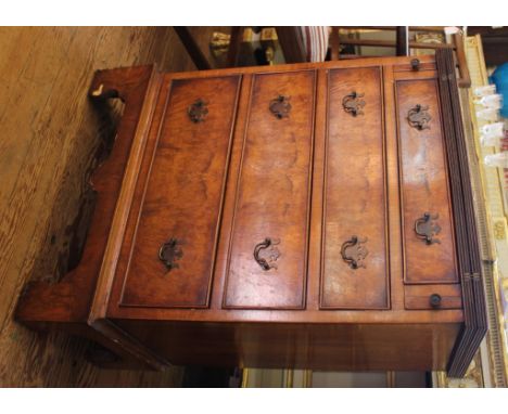 A Georgian-style walnut dressing chest with fold over top and fluted rim, four graduated drawers under with brass drop handle