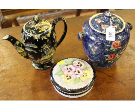 A multi-coloured ceramic biscuit barrel with floral depictions, hand painted dish with lid, pansies and a Royal Winton 'Pekin