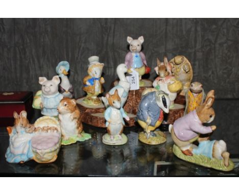 An assortment of thirteen Beatrix Potter ceramic figurines, some on a stylized base 