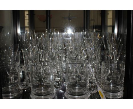 A large assortment of Dartington Crystal drink ware, comprising five champagne flutes, six white wine glass, five red wine gl