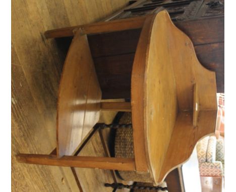 An early 20th century pine corner unit with shaped gallery, one shelf under on square legs, 90cm x 84cm