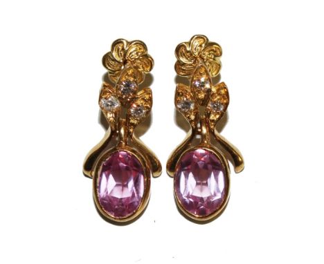 A pair of pink sapphire and white Cupid zirconia set drop earrings in 18 carat gold 