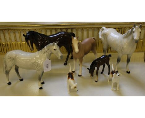 A selection of three Beswick horses, one foal and two beagles and one other unglazed ceramic horse (7)