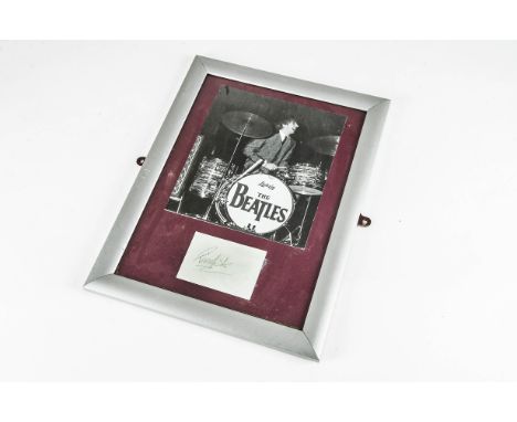Ringo Starr, a Ringo Starr b/w print of him playing the drums with a signature on card mounted below in a framed and glazed p