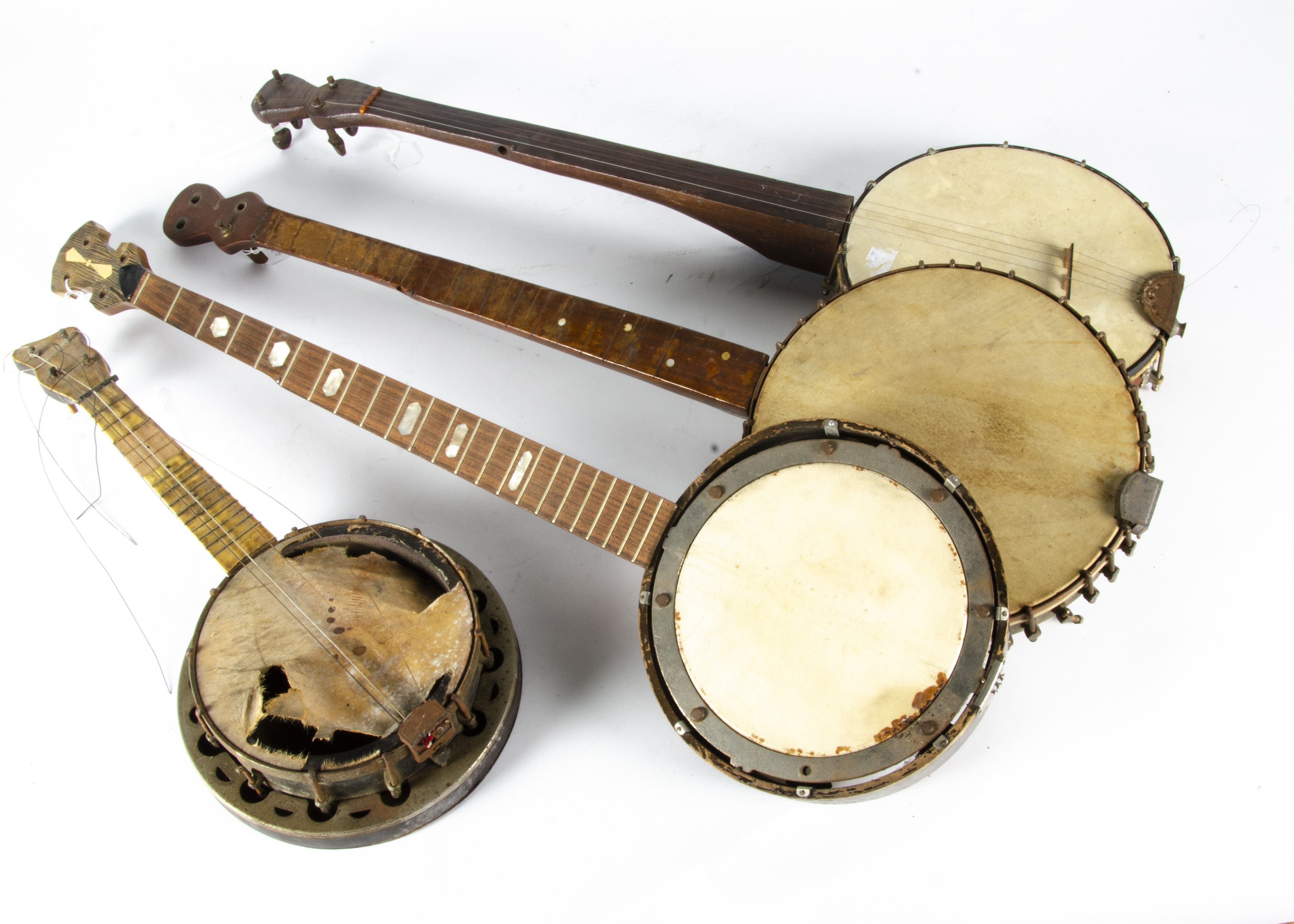 Banjos, two 19th Century fretless banjos, ukulele banjo and another