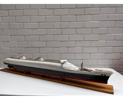 A very well done, large scale model of a passenger ship. Unmarked, wood construction in original paint, mounted to a wood bas