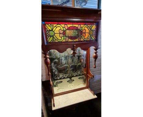 Antique, Victorian era back bar mirror with the text "Private Bar" on it. Beautiful mirror in a wood frame with light behind 