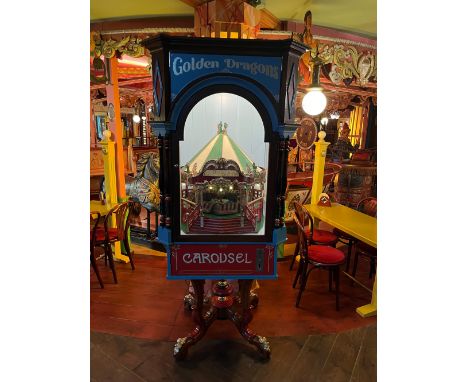 Completely restored coin-operated Denjeani Golden Dragons carousel scale model from approx 1950. Mechanical parts, lighting a