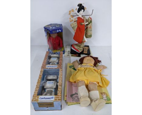 A mixed lot of figurines to include an interactive E.T, a Cabbage Patch Kid with adoption paperwork, 'Dance of Autumn' by Kak