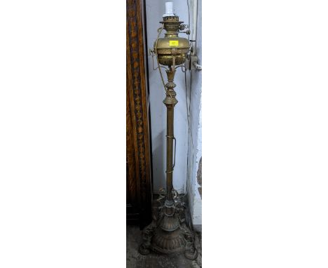 A Victorian gilt brass floor standing oil lamp Location: 