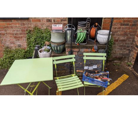 Garden related items and tools to include plant pots, weed control fabric string, markers, a watering can, a table and two ch