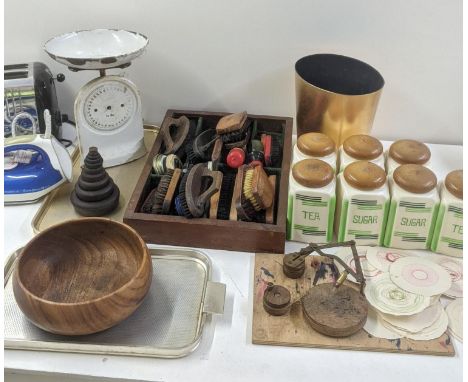 A mixed lot of kitchen ware to include sugar and tea pots, vintage weighting scales, and other itemsLocation:If there is no c