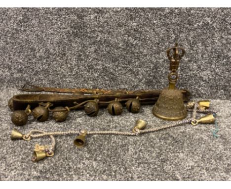 A fine cast bronze bell bearing vertical ring handle, face and surmounted by a crown together with horse harness and goats co