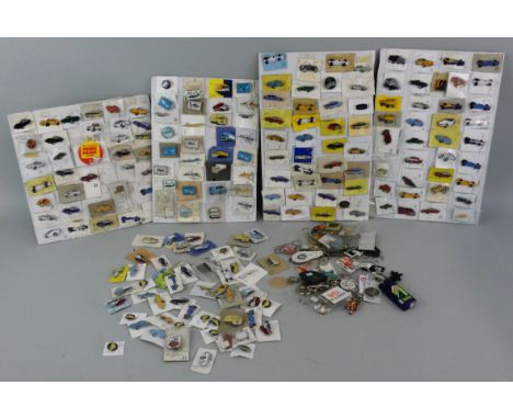 A large quantity of metal and enamel lapel badges, mainly cars, but also motorcycles and lorries.