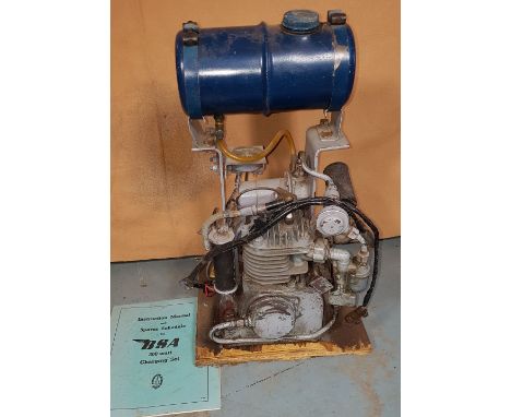A BSA 300 watt battery charging engine, model 2-B-12, service number 5067829, together with an instruction book.
